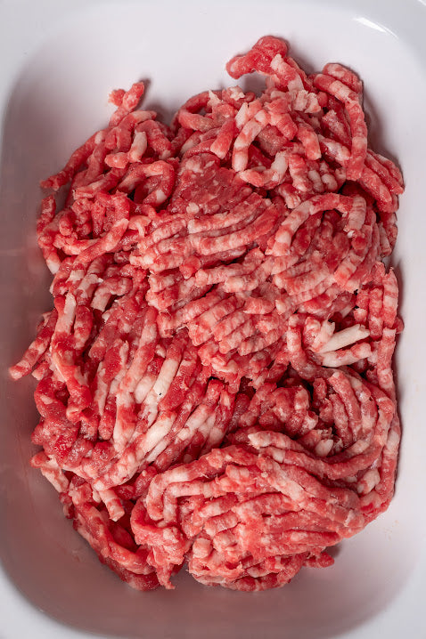 A bowl filled with fresh Mangalitza pork mince meat.